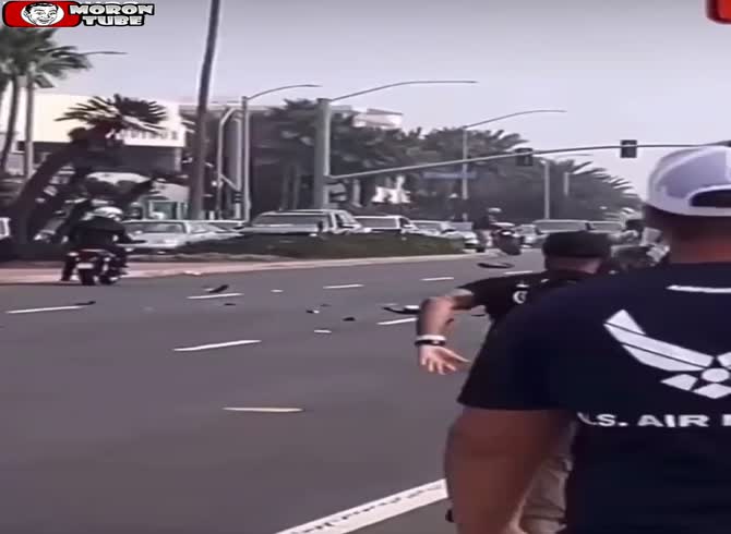 Video :A biker does a backward cartwheel while speeding through town, and it doesn't work out well for him (Warning - startling)